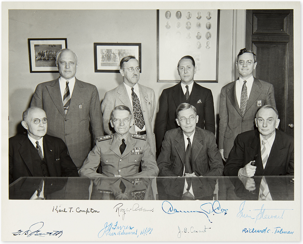 (SCIENTISTS.) Group Photograph Signed, by 8 members of the executive committee of the National Defense Research Committee,